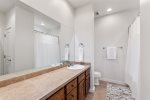 En-suite bath with plenty of counter space 